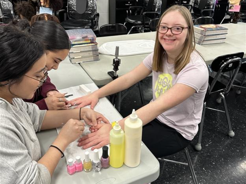 Centennial High cosmetology students style hair